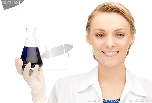 Image of lab worker holding up test tube