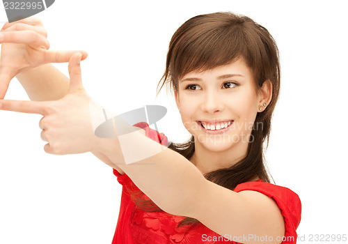 Image of teenage girl creating a frame with fingers