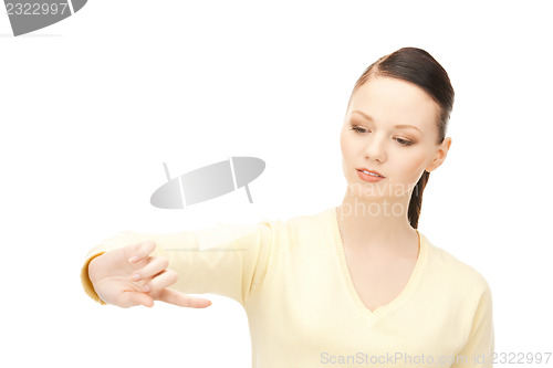 Image of businesswoman working with something imaginary