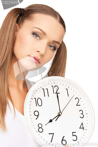 Image of woman holding big clock