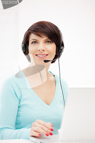 Image of helpline operator with laptop computer