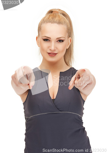 Image of lovely fitness instructor pointing her finger