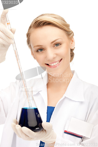 Image of lab worker holding up test tube