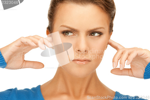 Image of woman with fingers in ears