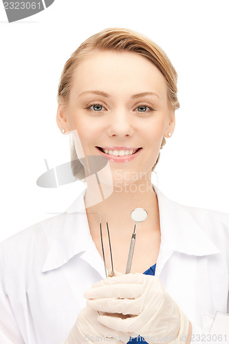 Image of dentist with tools