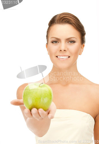 Image of young beautiful woman with green apple