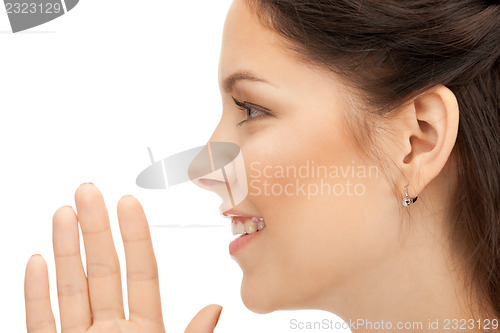 Image of woman whispering gossip