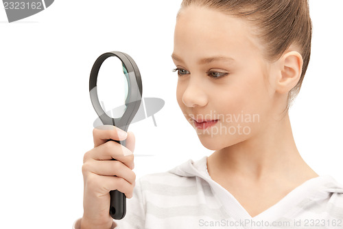 Image of teenage girl with magnifying glass