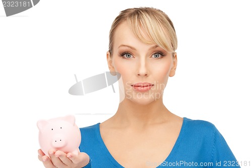 Image of lovely woman with piggy bank