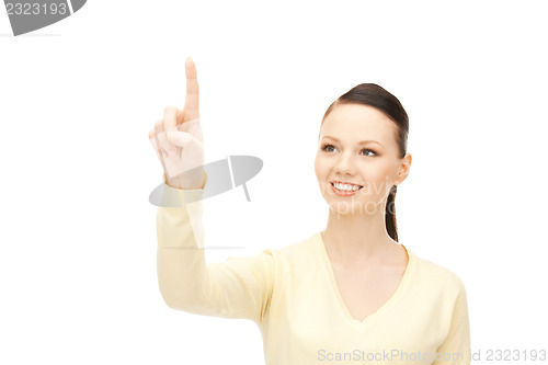 Image of businesswoman working with something imaginary