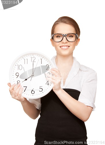 Image of woman holding big clock