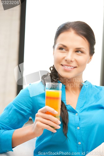 Image of beautiful woman with glass of juice