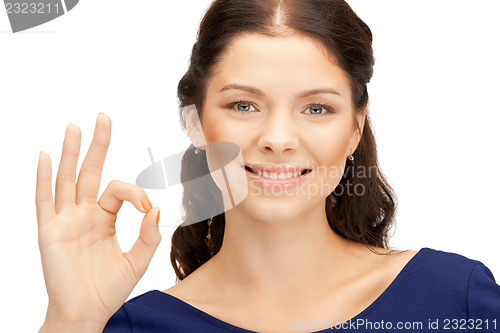 Image of lovely teenage girl showing ok sign