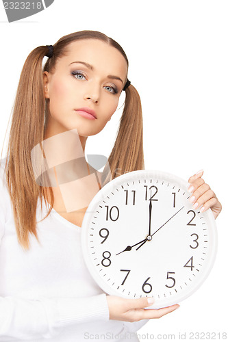 Image of woman holding big clock