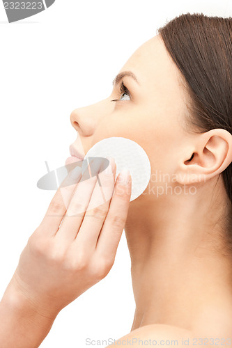 Image of beautiful woman with cotton pad