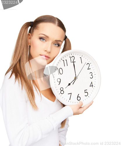 Image of woman holding big clock