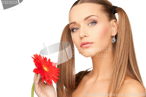 Image of lovely woman with red flower