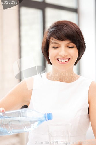 Image of beautiful woman with glass of water