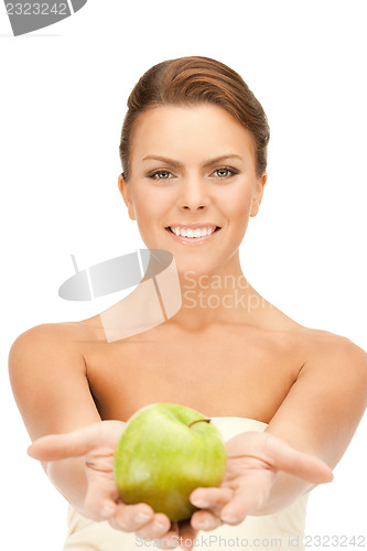 Image of young beautiful woman with green apple