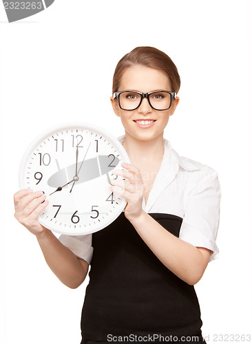 Image of woman holding big clock