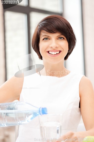 Image of beautiful woman with glass of water