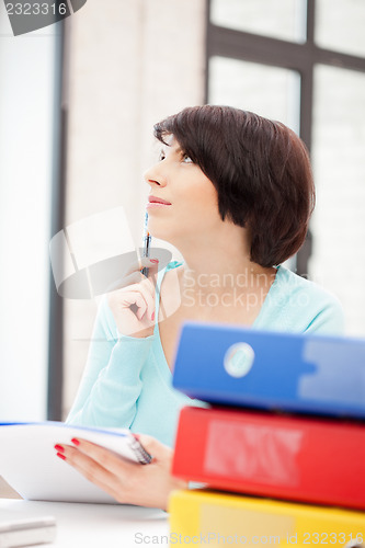 Image of woman with folders