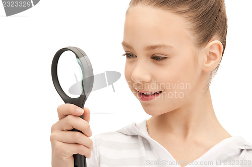 Image of teenage girl with magnifying glass