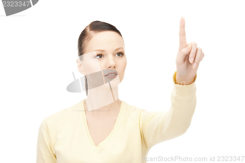 Image of businesswoman working with something imaginary