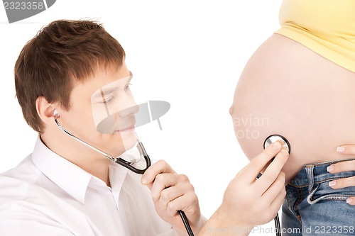 Image of doctor and pregnant woman belly