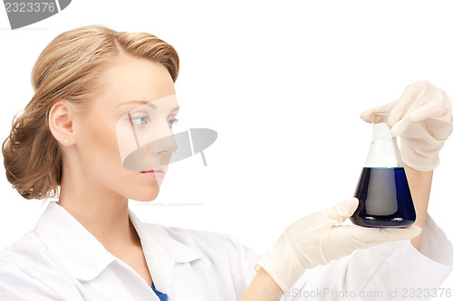 Image of lab worker holding up test tube