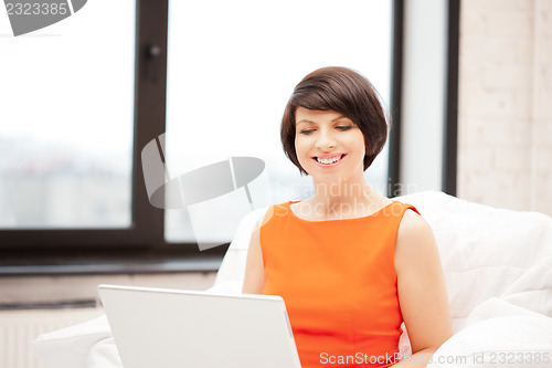 Image of happy woman with laptop computer