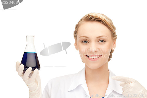 Image of lab worker holding up test tube