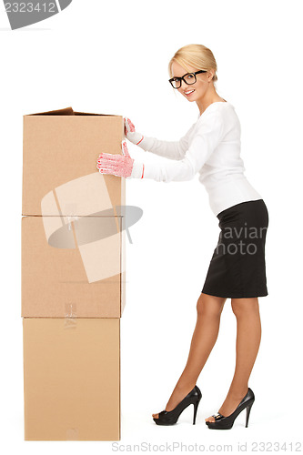 Image of attractive businesswoman with big boxes