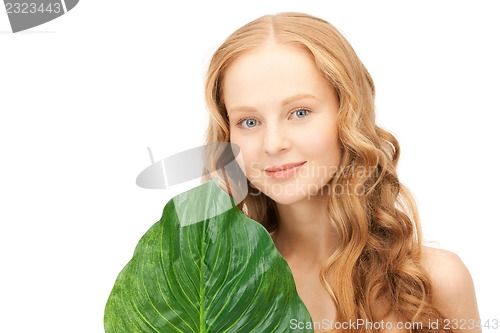 Image of woman with green leaf