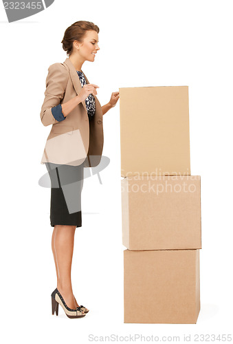 Image of attractive businesswoman with big boxes