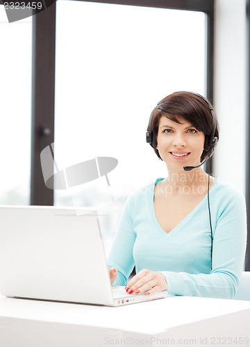 Image of helpline operator with laptop computer