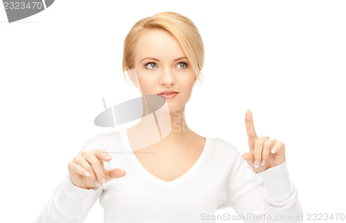 Image of businesswoman working with something imaginary