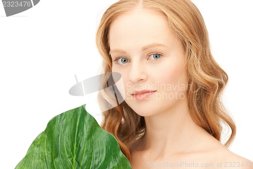 Image of woman with green leaf