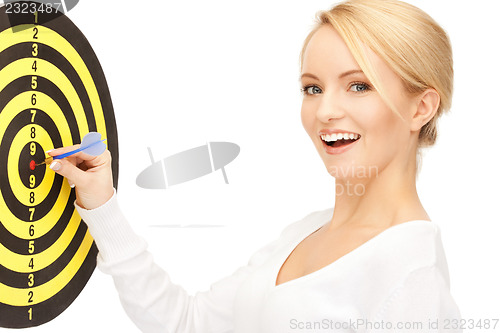 Image of businesswoman with dart and target