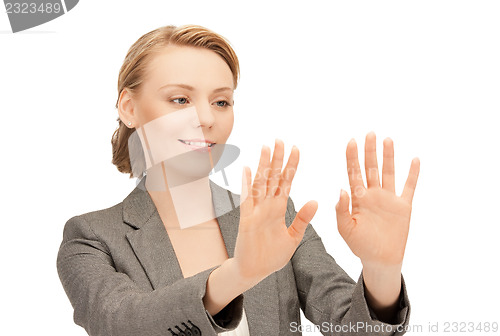 Image of businesswoman working with something imaginary