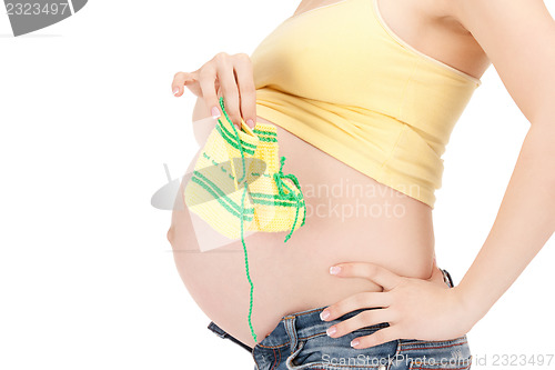 Image of pregnant woman belly and socks