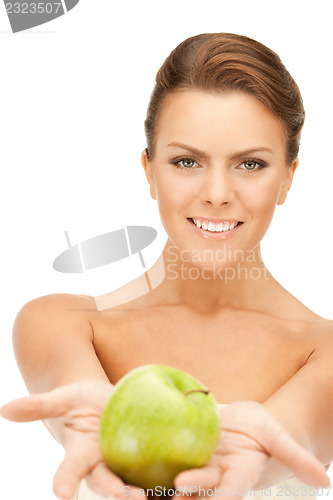 Image of young beautiful woman with green apple