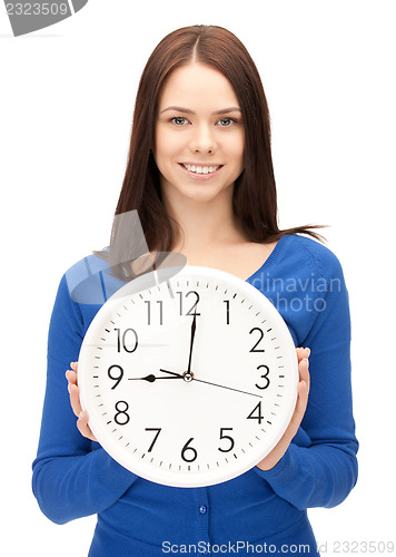 Image of woman holding big clock