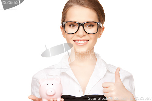 Image of lovely woman with piggy bank