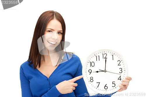 Image of woman holding big clock