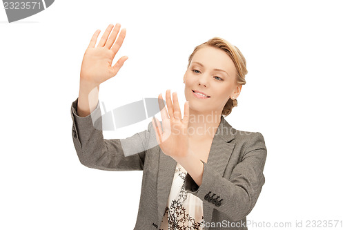 Image of businesswoman working with something imaginary