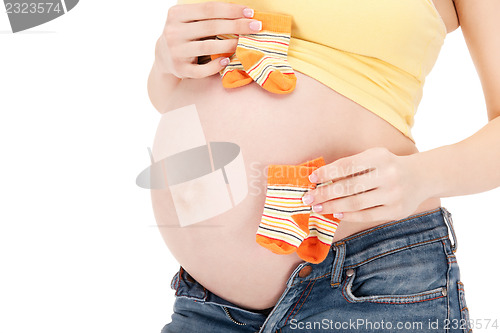 Image of pregnant woman belly and twin socks