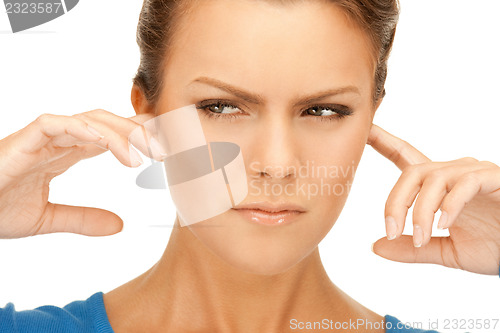 Image of woman with fingers in ears