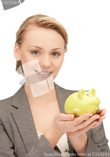 Image of lovely woman with piggy bank