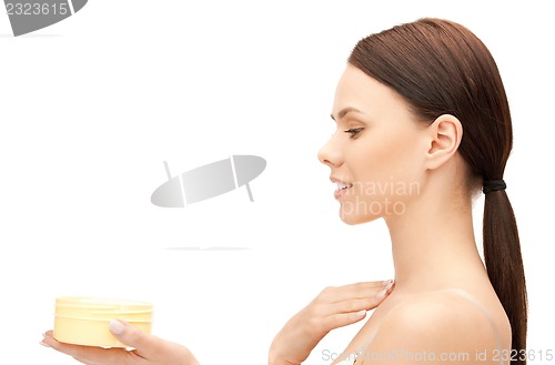 Image of beautiful woman with moisturizing creme